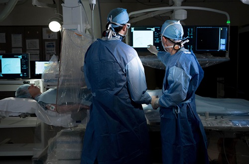 Radiology IR Resident and Dr. Scott Trerotola in IR Surgery